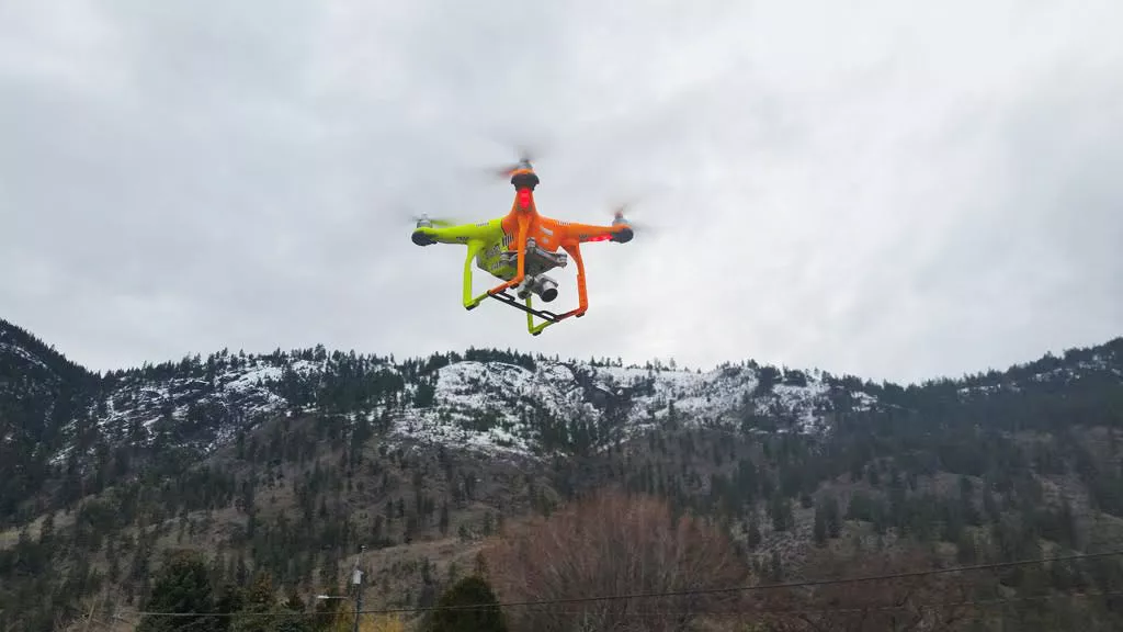 drone surveying land development site in Canada