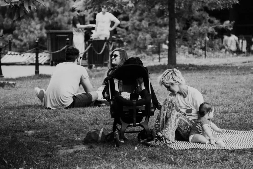 women in park with baby