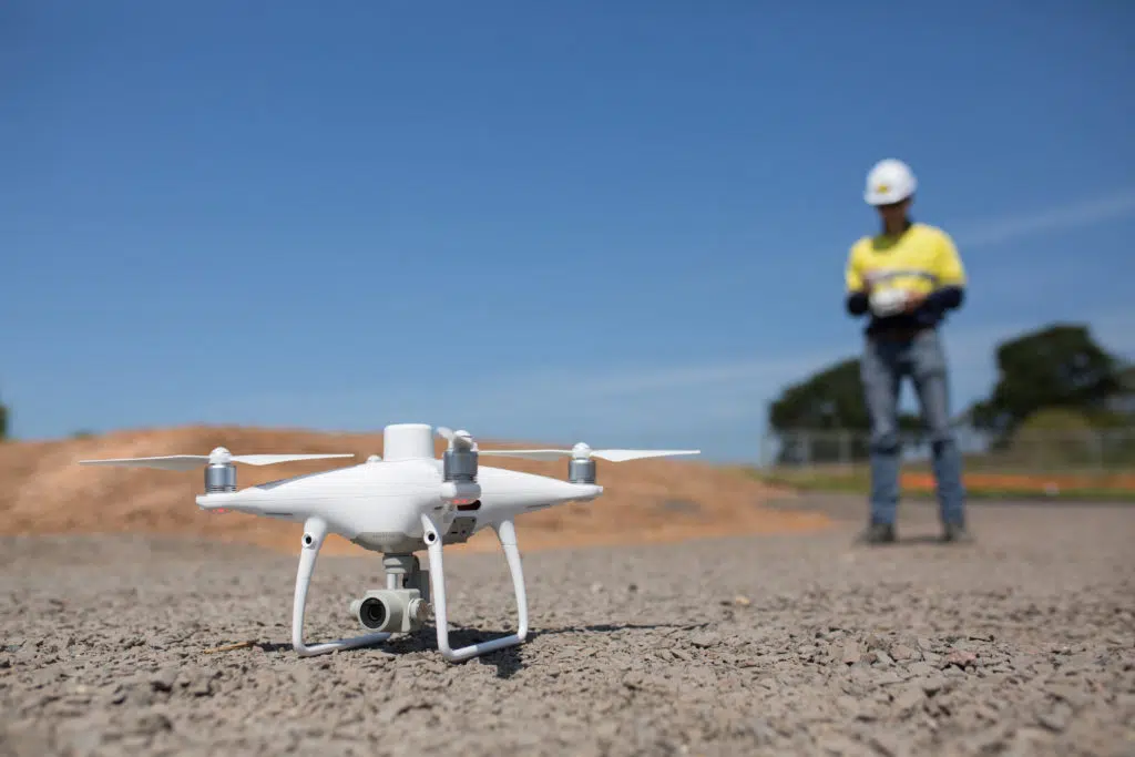 construction worker flying a drone