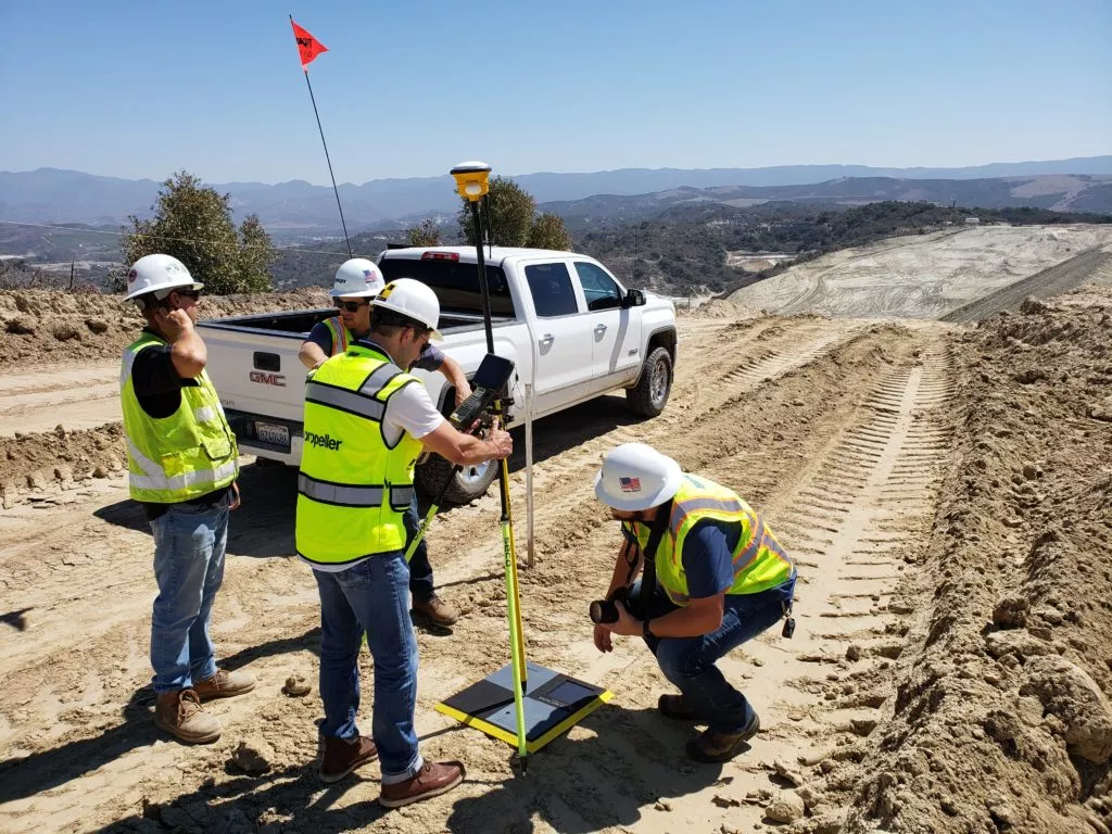 surveyor using a base station with an AeroPoint