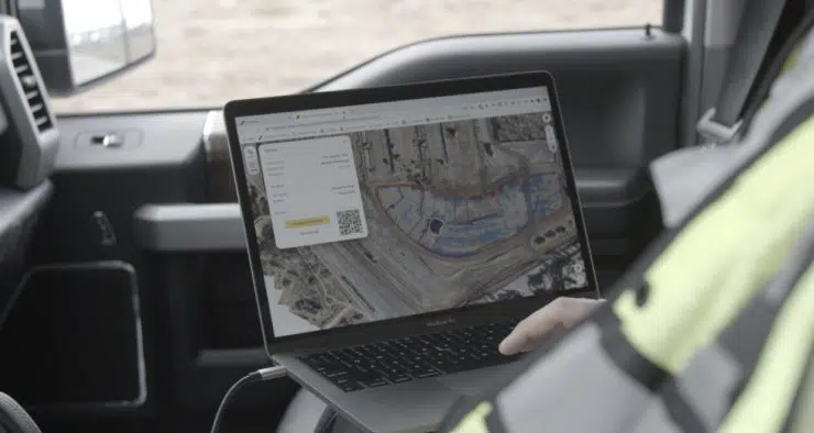 worker looking at propeller platform on screen